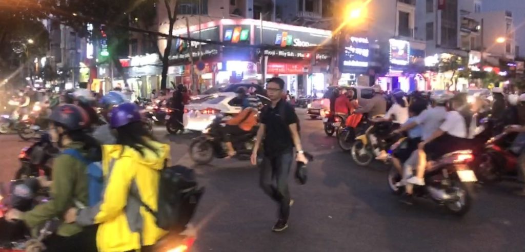 Crossing the street in Vietnam Southeast Asia